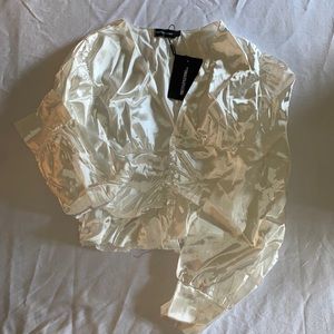 White satin button waist blouse.